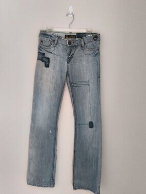 Odyn light-wash blue denim low-rise distressed jeans with dark patchwork size 28